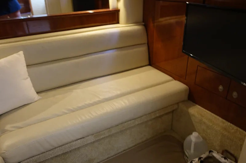 Slide: The Image of Luxurious interior of 2006 Sea Ray 44 Sundancer yacht with beige seating and TV. - 36