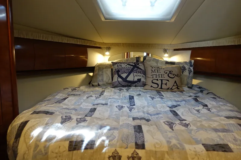 Slide: The Image of Luxurious cabin interior of 2006 Sea Ray 44 Sundancer yacht with cozy bedding. - 39