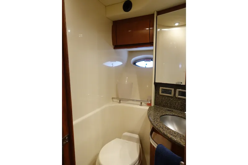 Slide: The Image of Luxurious bathroom in 2006 Sea Ray 44 Sundancer yacht with granite countertop and modern fixtures. - 44