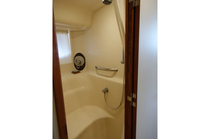 Slide: The Image of Shower area inside 2006 Sea Ray 44 Sundancer yacht, featuring a compact design. - 46