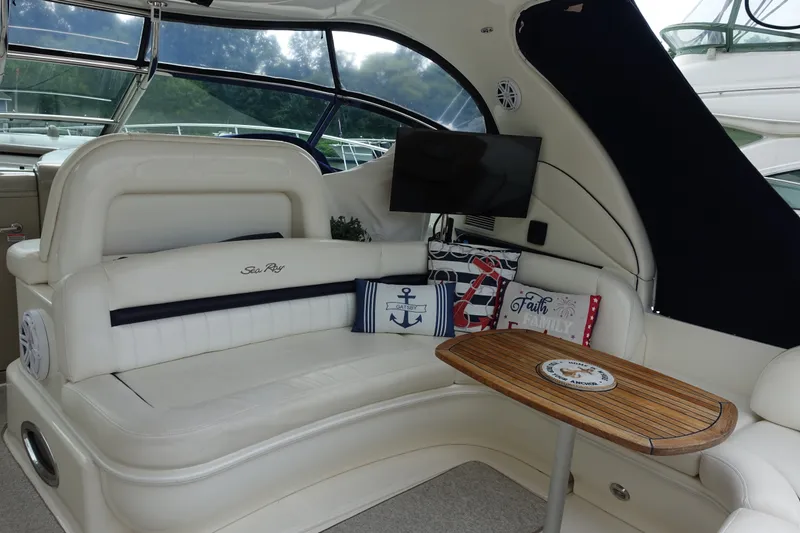 Slide: The Image of Luxurious interior of 2006 Sea Ray 44 Sundancer yacht with plush seating and decorative pillows. - 18