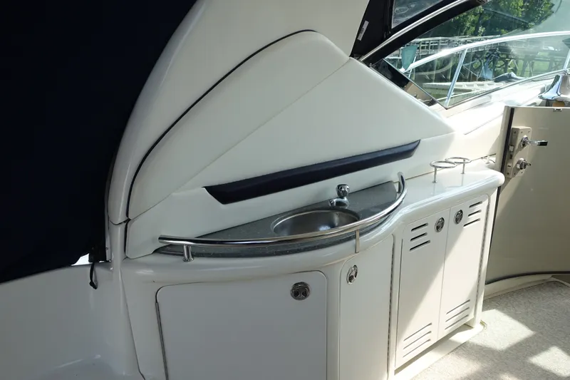 Slide: The Image of 2006 Sea Ray 44 Sundancer yacht interior with sink and storage cabinets. - 13