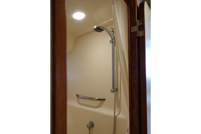 Slide: The Image of Shower area inside 2006 Sea Ray 44 Sundancer yacht, featuring modern fixtures and lighting. - 45