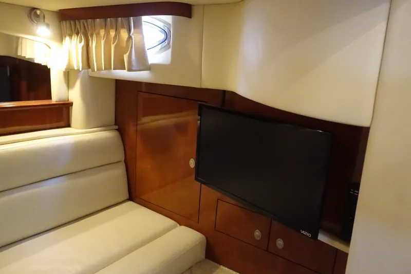 Slide: The Image of Luxurious interior of 2006 Sea Ray 44 Sundancer with TV and elegant seating. - 37