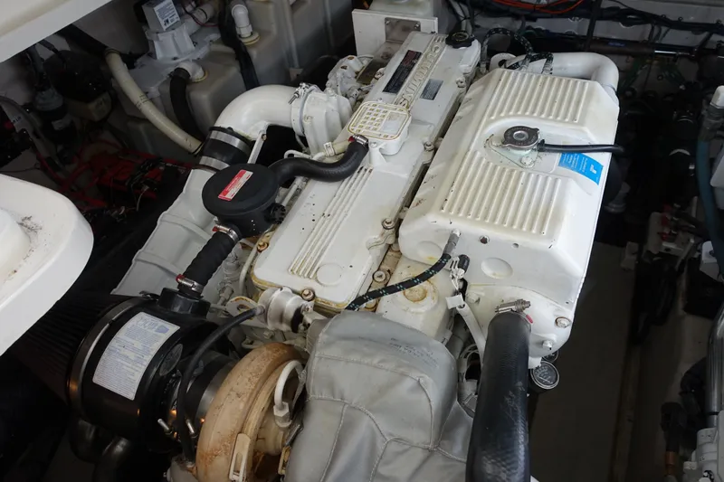 Slide: The Image of Engine compartment of a 2006 Sea Ray 44 Sundancer boat, showcasing detailed machinery. - 50