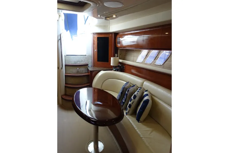Slide: The Image of Luxurious interior of 2006 Sea Ray 44 Sundancer yacht with elegant seating and wooden accents. - 55
