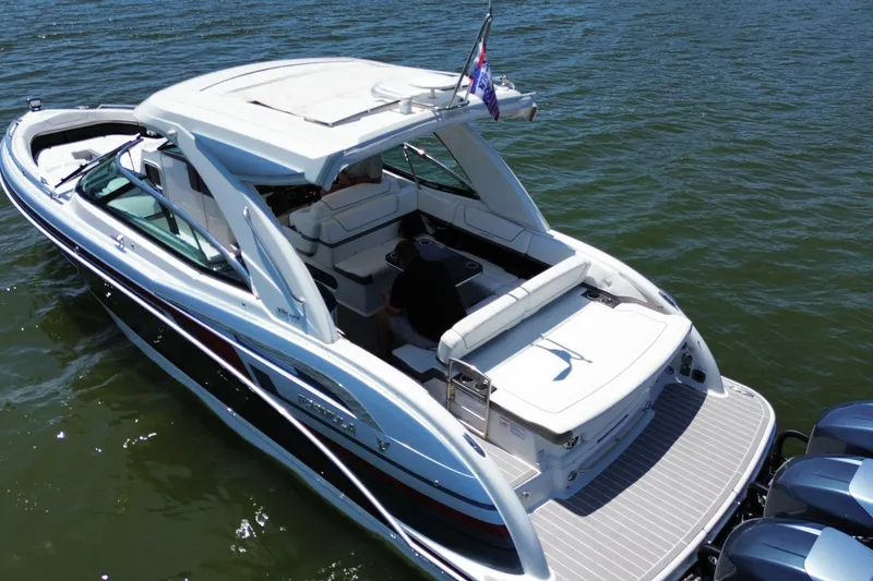 Slide: The Image of 2020 Formula 350 Crossover Bowrider OB on water, showcasing sleek design and spacious seating. - 7