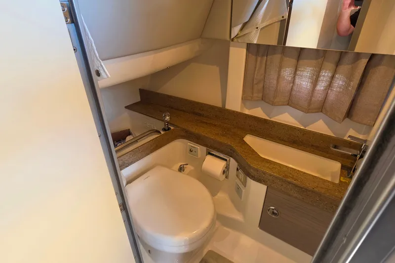 Slide: The Image of 2020 Formula 350 Crossover Bowrider OB bathroom with modern fixtures and compact design. - 40