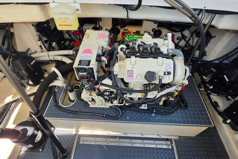 Slide: The Image of Engine compartment of a 2020 Formula 350 Crossover Bowrider OB, showcasing mechanical components. - 43