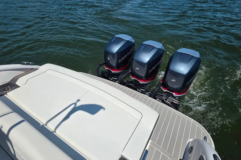 Slide: The Image of 2020 Formula 350 Crossover Bowrider OB with triple outboard engines on water. - 48