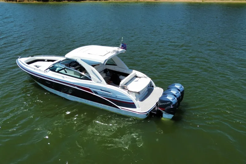 Slide: The Image of 2020 Formula 350 Crossover Bowrider OB on calm water, featuring twin Mercury outboards. - 11
