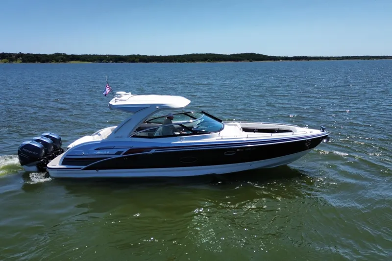 Slide: The Image of 2020 Formula 350 Crossover Bowrider OB cruising on a sunny lake. - 10