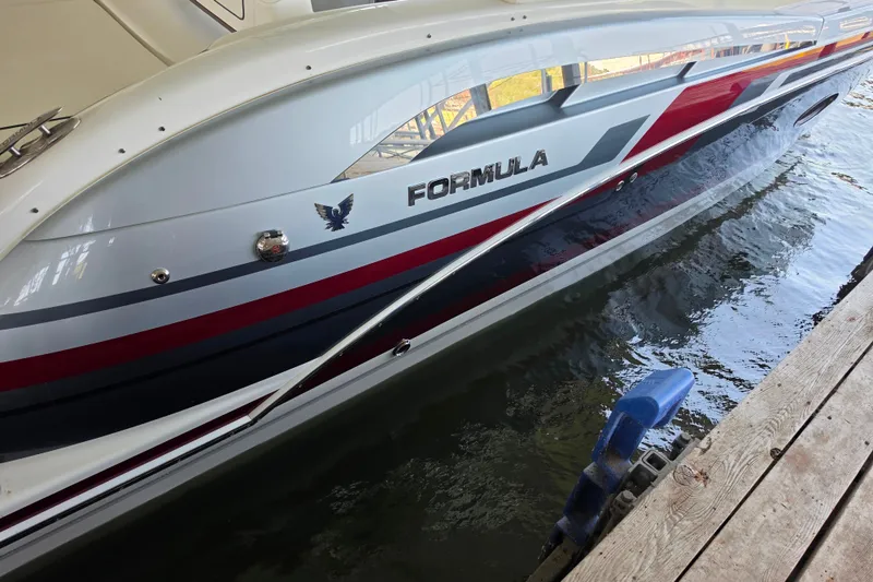 Slide: The Image of 2020 Formula 350 Crossover Bowrider OB docked, showcasing sleek design and vibrant colors. - 15