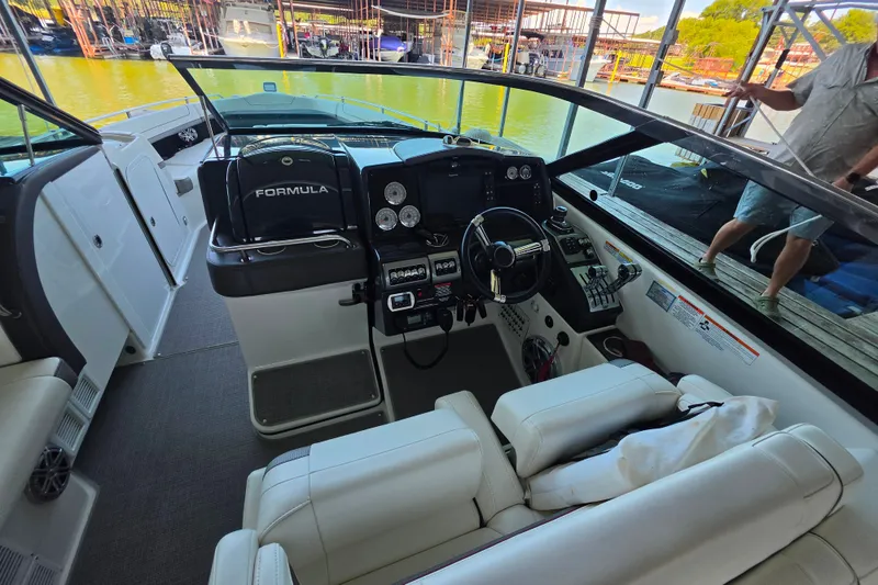 Slide: The Image of 2020 Formula 350 Crossover Bowrider OB interior with helm and seating area. - 19