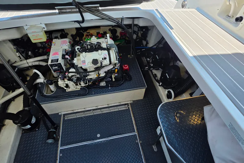 Slide: The Image of Engine compartment of a 2020 Formula 350 Crossover Bowrider OB, showcasing mechanical components. - 46