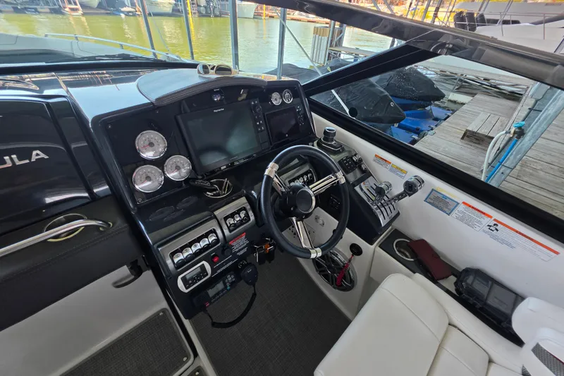 Slide: The Image of 2020 Formula 350 Crossover Bowrider OB cockpit with modern controls and navigation system. - 29