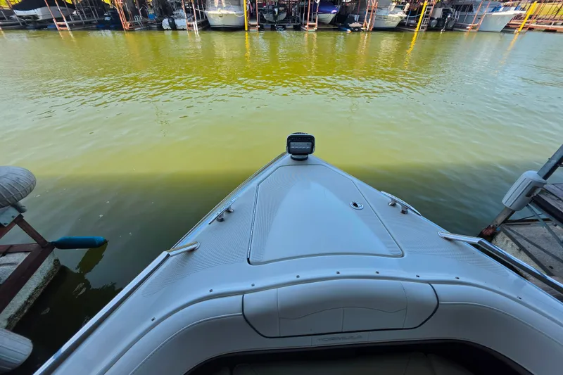 Slide: The Image of 2020 Formula 350 Crossover Bowrider OB docked on calm water. - 31