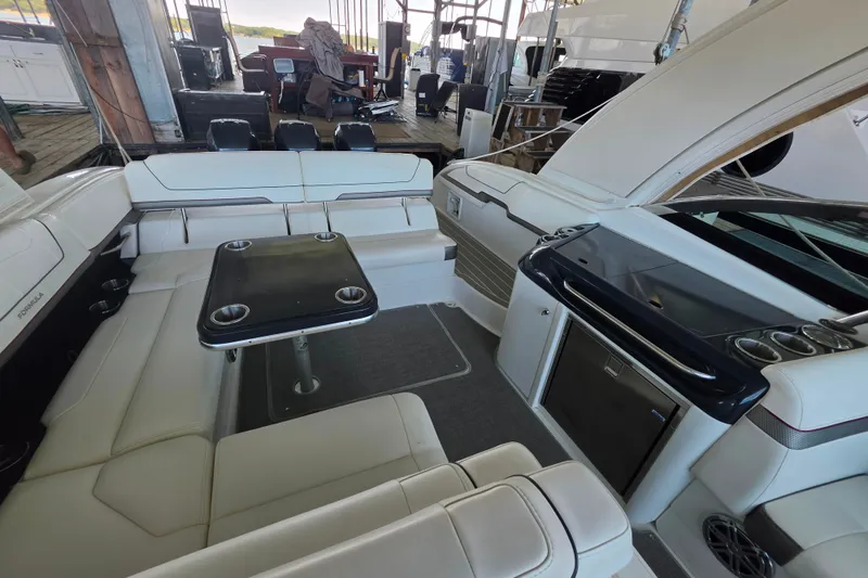 Slide: The Image of Luxurious interior of a 2020 Formula 350 Crossover Bowrider OB with seating and table. - 26