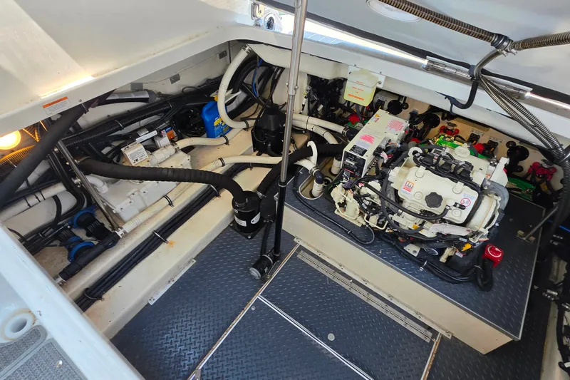 Slide: The Image of Engine compartment of a 2020 Formula 350 Crossover Bowrider OB, showcasing detailed mechanical components. - 45