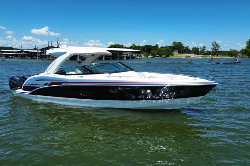 Slide: The Image of 2020 Formula 350 Crossover Bowrider OB on a sunny lake, showcasing sleek design. - 1