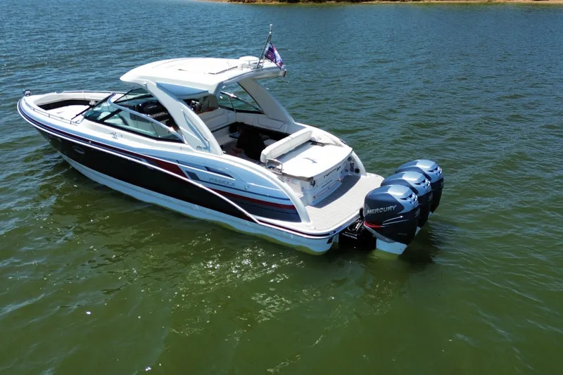 Slide: The Image of 2020 Formula 350 Crossover Bowrider OB on water, featuring twin Mercury outboard engines. - 4