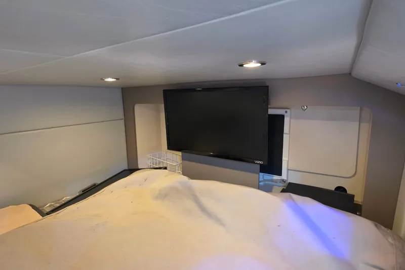 Slide: The Image of 2020 Formula 350 Crossover Bowrider OB cabin interior with TV and modern lighting. - 37