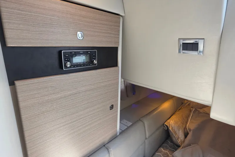 Slide: The Image of 2020 Formula 350 Crossover Bowrider OB cabin interior with modern audio system and cozy seating. - 35