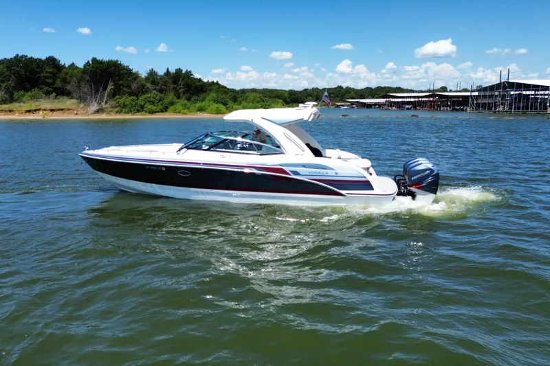 Slide: The Image of 2020 Formula 350 Crossover Bowrider OB cruising on a sunny lake. - 59