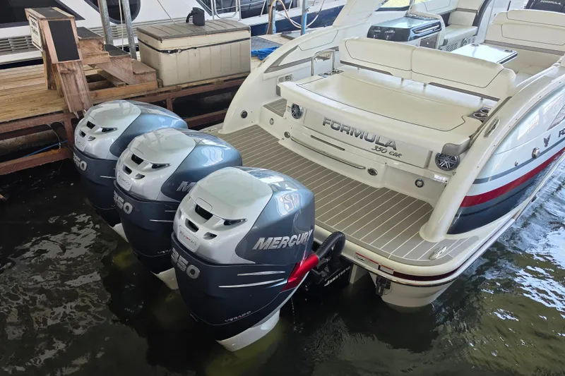 Slide: The Image of 2020 Formula 350 Crossover Bowrider OB with triple Mercury outboard engines docked. - 12