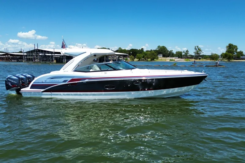 Slide: The Image of 2020 Formula 350 Crossover Bowrider OB on a sunny lake, showcasing sleek design and powerful engines. - 55