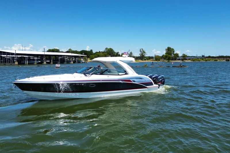 Slide: The Image of 2020 Formula 350 Crossover Bowrider OB cruising on a sunny lake. - 60