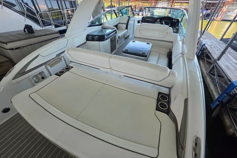 Slide: The Image of 2020 Formula 350 Crossover Bowrider OB with spacious seating and sleek design. - 16