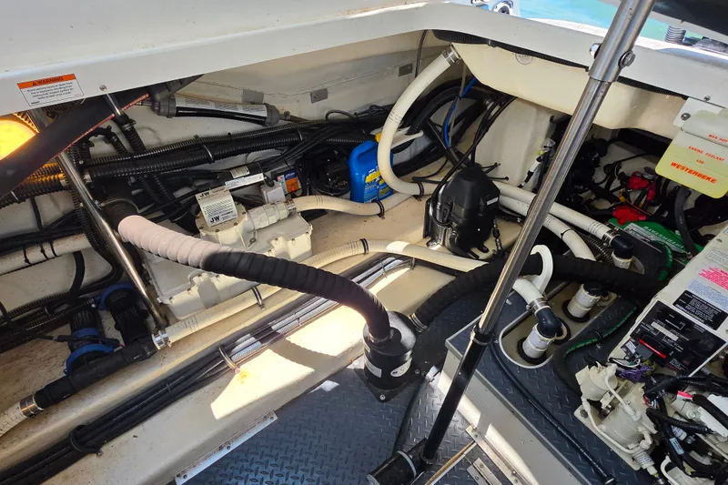 Slide: The Image of Engine compartment of a 2020 Formula 350 Crossover Bowrider OB, showcasing wiring and components. - 42