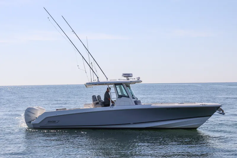 The Image of 2023 Boston Whaler 330 Outrage boat cruising on open water. - 0