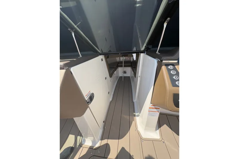 Slide: The Image of 2024 Chaparral 247 SSX boat interior with sleek design and modern controls. - 7