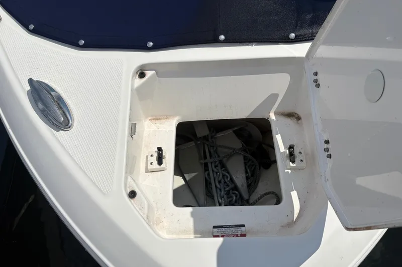 Slide: The Image of Open anchor storage compartment on 2024 Chaparral 247 SSX boat. - 5