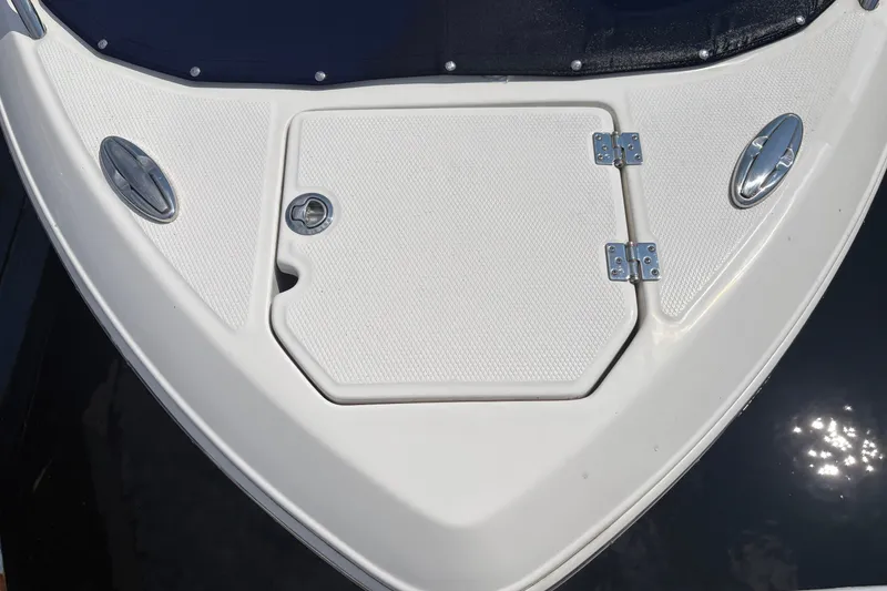 Slide: The Image of 2024 Chaparral 247 SSX boat deck with hatch and chrome fittings. - 4