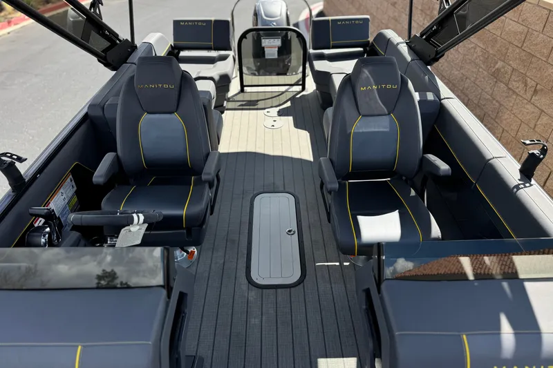 Slide: The Image of Interior of 2025 Manitou EXPLORE 24 boat with sleek seating and modern design. - 13