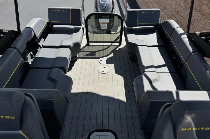 Slide: The Image of Interior view of 2025 Manitou EXPLORE 24 pontoon boat with spacious seating and modern design. - 14