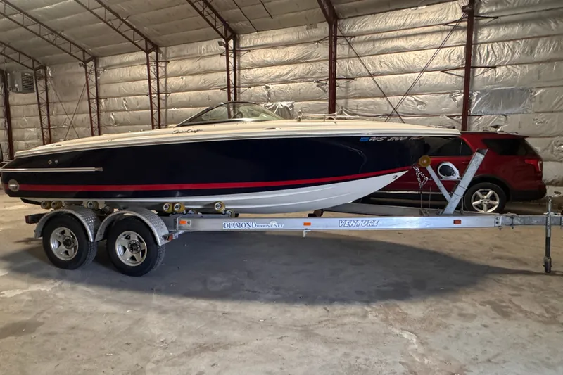 The Image of 2005 Chris Craft Speedster boat on trailer in a warehouse setting. - 0
