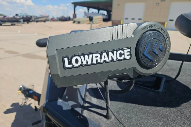 Slide: The Image of Lowrance device on 2023 Ranger RT178 boat, outdoor setting with clear sky. - 7