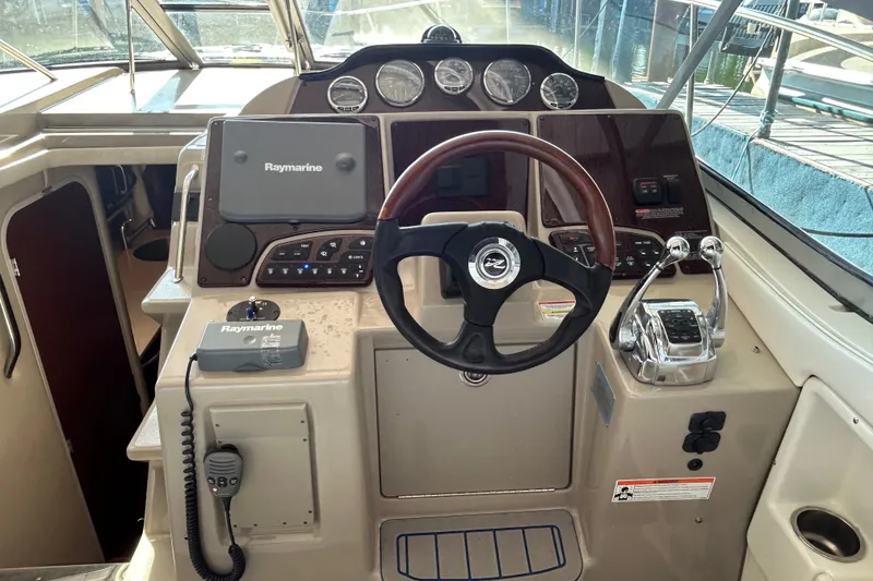 Slide: The Image of 2008 Sea Ray Sundancer 330 helm with Raymarine electronics and dual throttle controls. - 20