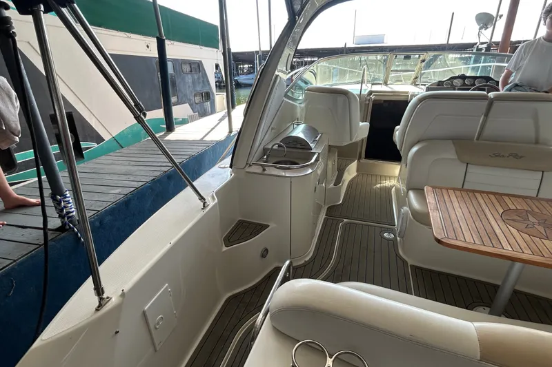 Slide: The Image of Interior view of 2008 Sea Ray Sundancer 330 yacht with seating and wooden table. - 30