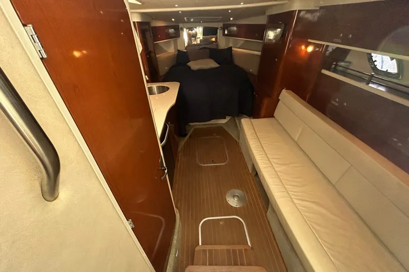 Slide: The Image of Interior of 2008 Sea Ray Sundancer 330 yacht, featuring cozy seating and elegant wood finishes. - 31