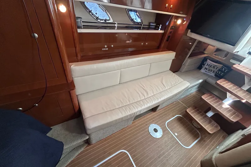 Slide: The Image of Interior of 2008 Sea Ray Sundancer 330 yacht with seating and wooden flooring. - 34