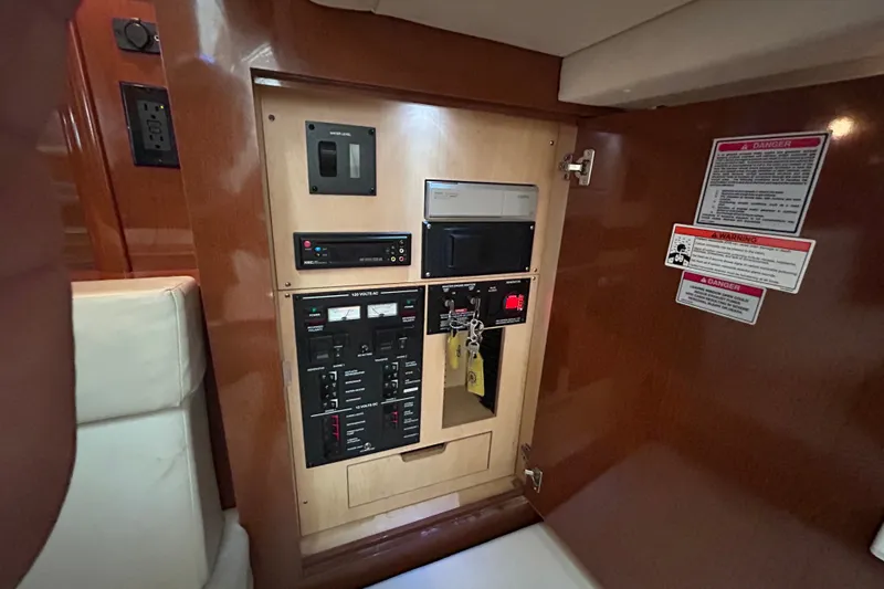Slide: The Image of Electrical panel inside a 2008 Sea Ray Sundancer 330 yacht cabin. - 14