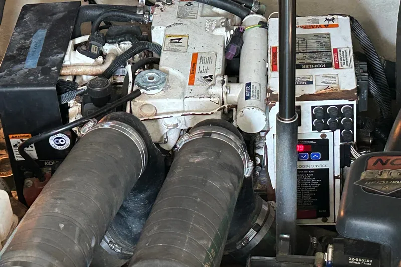 Slide: The Image of Engine compartment of a 2008 Sea Ray Sundancer 330 boat, featuring mechanical components. - 26