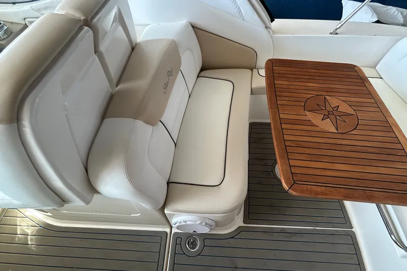 Slide: The Image of Luxurious seating and wooden table on 2008 Sea Ray Sundancer 330 yacht. - 29