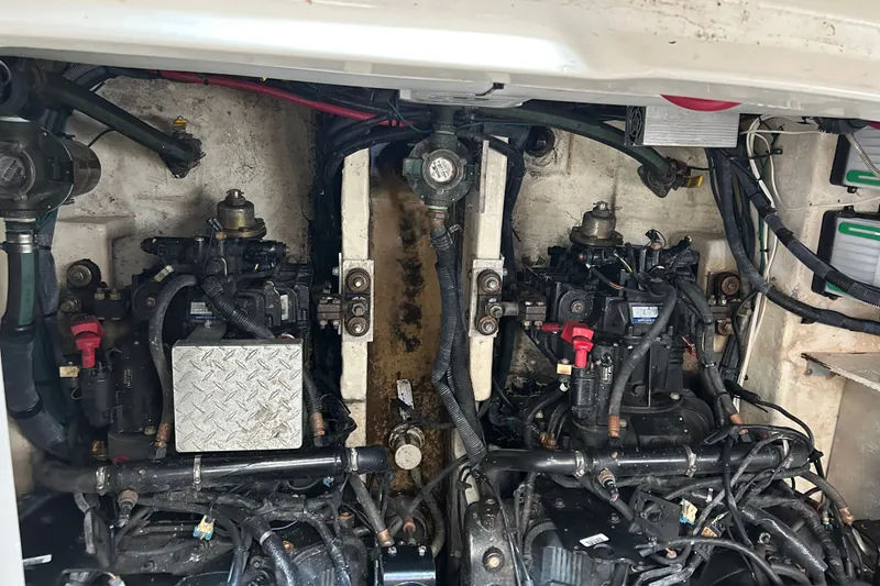 Slide: The Image of Engine compartment of a 2008 Sea Ray Sundancer 330, showcasing dual engines and wiring. - 5