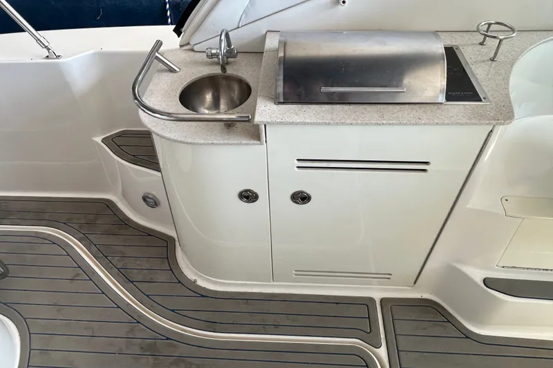 Slide: The Image of 2008 Sea Ray Sundancer 330 yacht kitchenette with sink and grill on deck. - 22